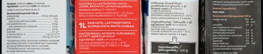 Neljän maitotölkin tiedot käytetystä kuumennusmenetelmästä: ”pastöroitu maito”, ”pastöroitu laktoositon maitojuoma”, ”korkeassa lämpötilassa pastöroitu kevytmaito”, ”laktoositon iskukuumennettu (UHT) maito”.